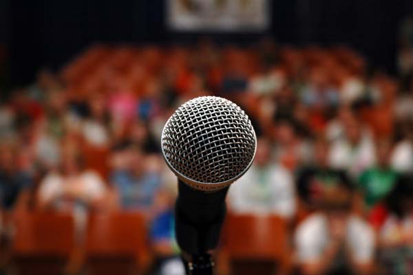 Microphone with blurred audience